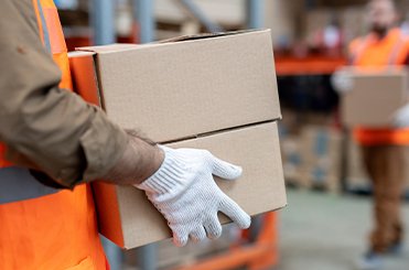 House shifting services in Ajman with movers packing boxes